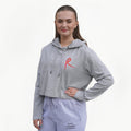 Heather grey cropped hoodie with a red arabesque symbol on the front and the Royal Academy of Dance logo on the cuff.