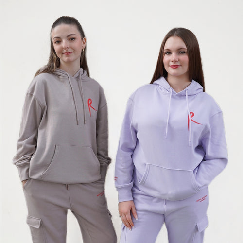 Hoodie with a drawstring and a kangaroo pocket. Arabesque R on chest and Royal Academy of Dance on cuff in red. 