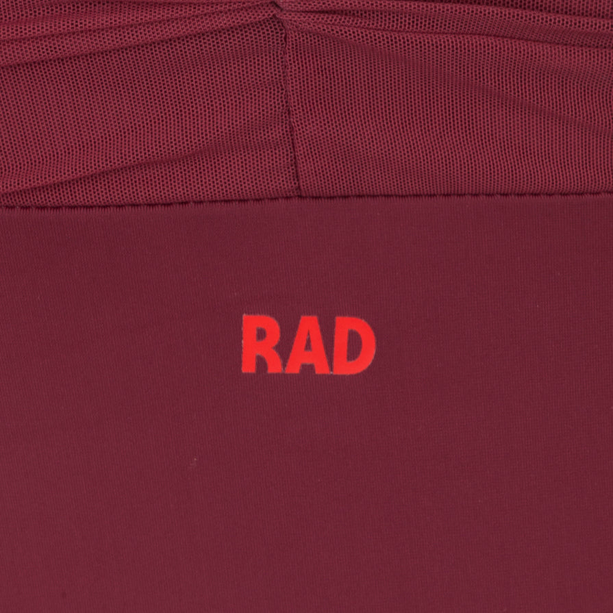 Burgundy Callie leotard is the official RAD vocational grade female ballet uniform, blending a professional balletcore aesthetic with sustainable dancewear standards. Crafted from eco-friendly ECONYL recycled fabric, the camisole features elegant mesh overlay panels and knot ruches. This regulation wear offers a modern silhouette and breathable comfort.