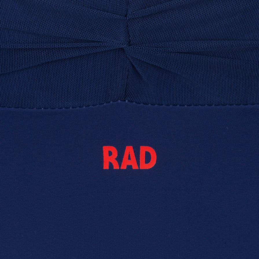 Navy Callie leotard is the official RAD vocational grade female ballet uniform, blending a professional balletcore aesthetic with sustainable dancewear standards. Crafted from eco-friendly ECONYL recycled fabric, the camisole features elegant mesh overlay panels and knot ruches. This regulation wear offers a modern silhouette and breathable comfort.