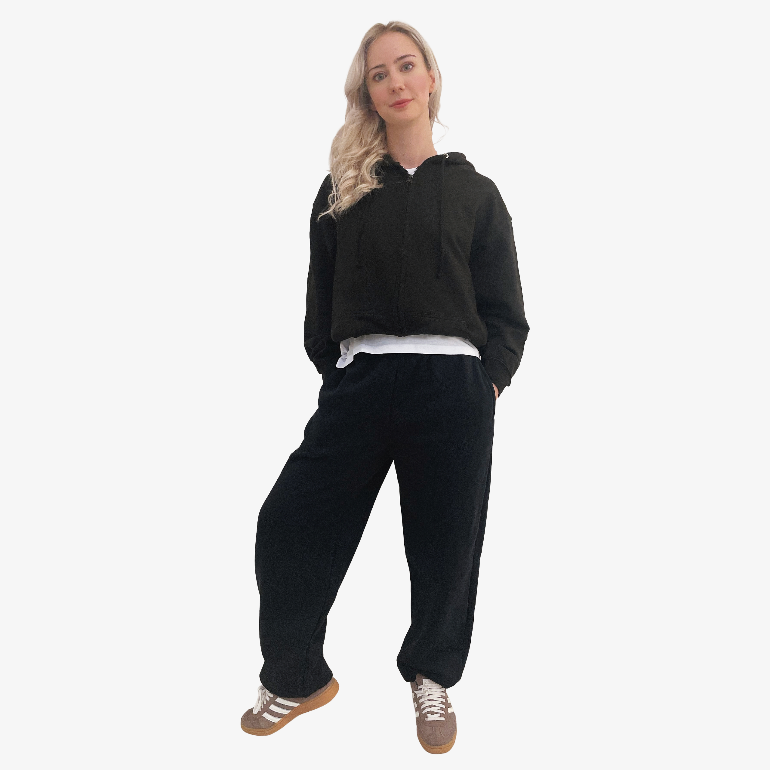 Woman wearing a black zip hoodie and black jogger pants 