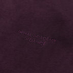 Purple jogger with embroidered " Royal Academy of Dance" logo close up