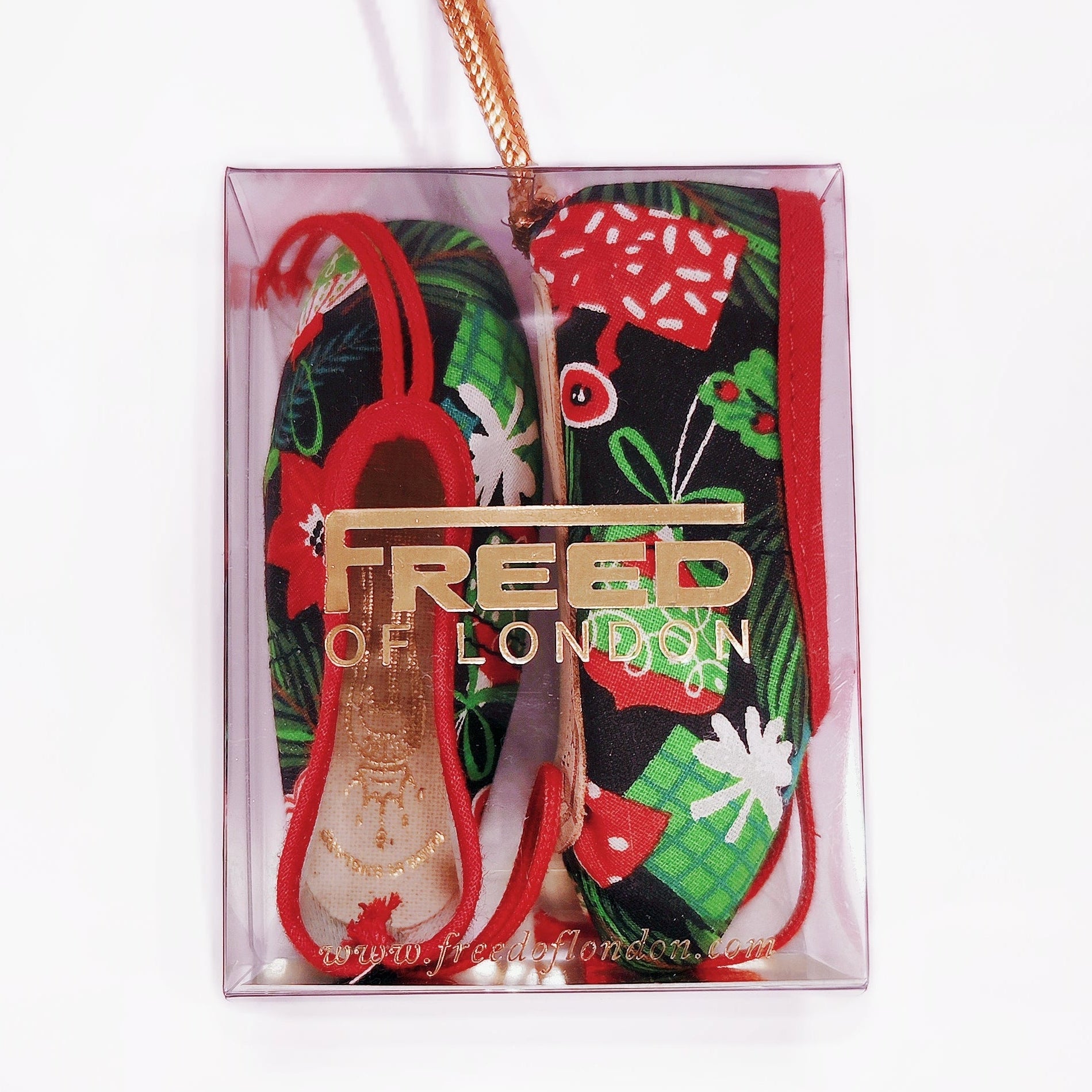 Colorful ballet shoes with floral design in a clear box, featuring the brand 'Freed of London'