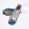Blue ballet shoes with white laces on a white background