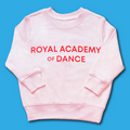 Kids pink sweatshirt with 'Royal Academy of Dance' logo in red