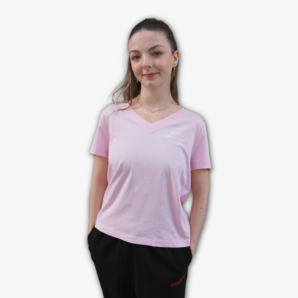 Light pink  v neck t-shirt with Royal Academy of Dance logo in white 