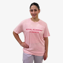  Woman wearing a pink 'Royal Academy of Dance' t-shirt 