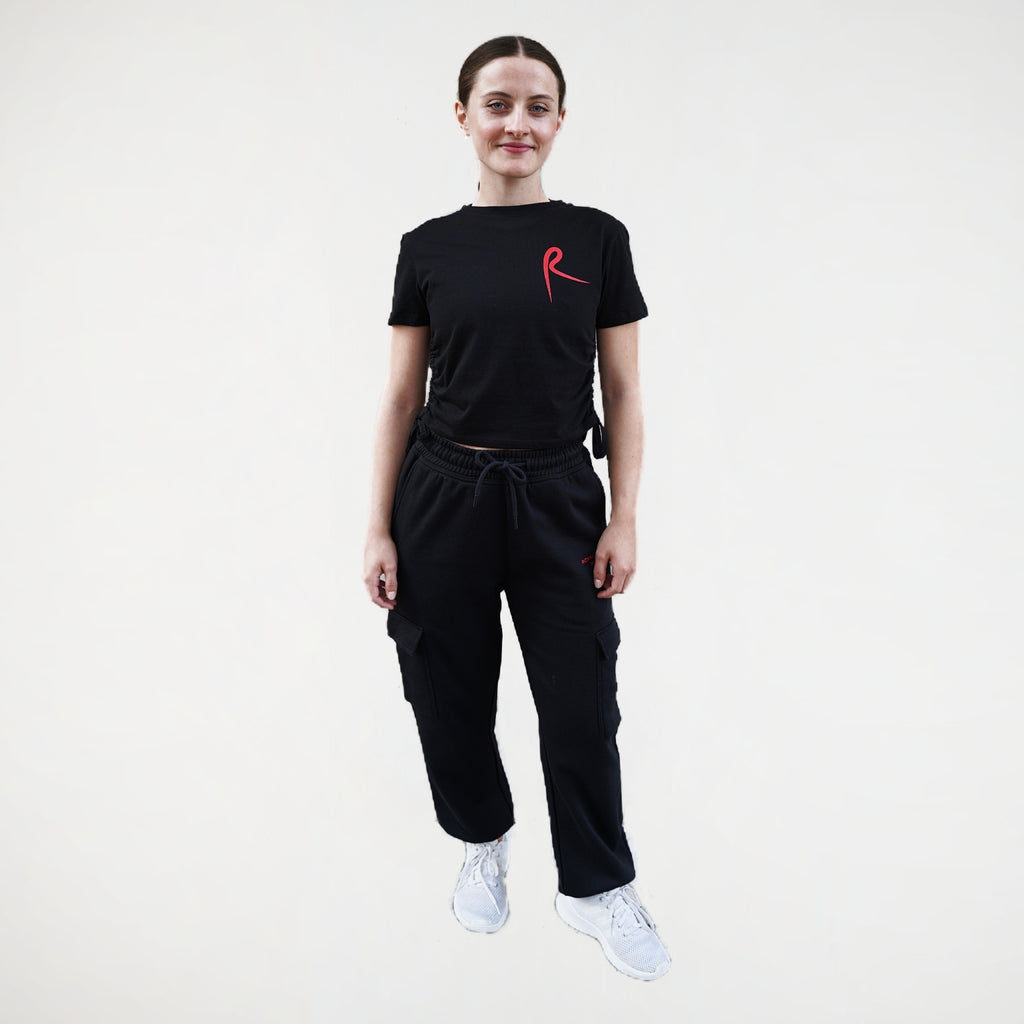 Black fitness jogger with cargo pockets and an elasticated waistband. Royal Academy of Dance logo in red