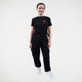 Black fitness jogger with cargo pockets and an elasticated waistband. Royal Academy of Dance logo in red