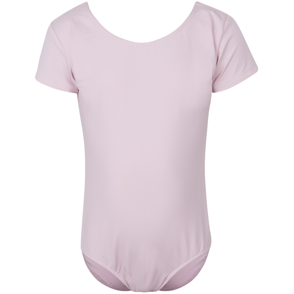  Freed of London Rosie leotard in pale pink, an officially RAD-approved regulation uniform for Pre-Primary and Primary ballet exams. The image shows a classic short-sleeved (capped sleeve) design made from high-performance sustainable ECONYL® recycled fabric, featuring a clean, scooped neckline and a fully lined interior for comfort. This essential piece of girls' dancewear represents the updated 2025 ballet uniform standards, combining traditional grace with modern eco-friendly materials.